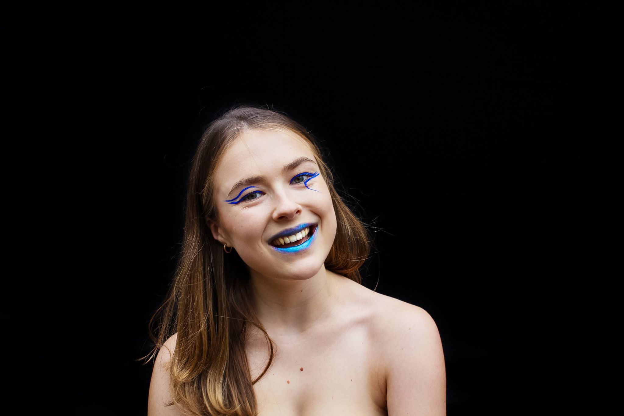 Image may contain: Smile, Girl, Finger, Lip, Teeth, Mouth, Skin, Clothing, Apparel, Female, Face, Person, Human