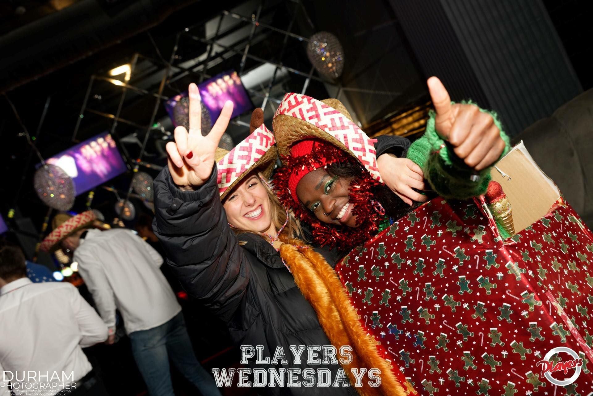 Image may contain: Finger, Club, Night Life, Leisure Activities, Festival, Crowd, Apparel, Clothing, Person, Human