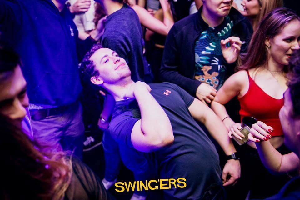 Image may contain: Night Life, Crowd, Audience, Night Club, Club, Party, Person, Human