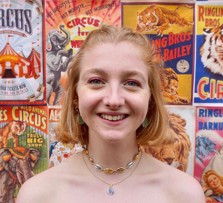 Image may contain: Teen, Child, Kid, Blonde, Woman, Girl, Female, Food, Animal, Wildlife, Mammal, Tiger, Person, Human, Necklace, Accessories, Accessory, Jewelry