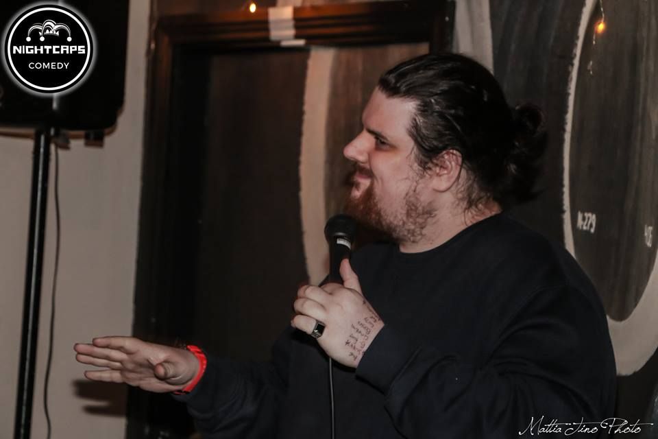 Image may contain: Beard, Finger, Electrical Device, Microphone, Crowd, Face, Person, Human