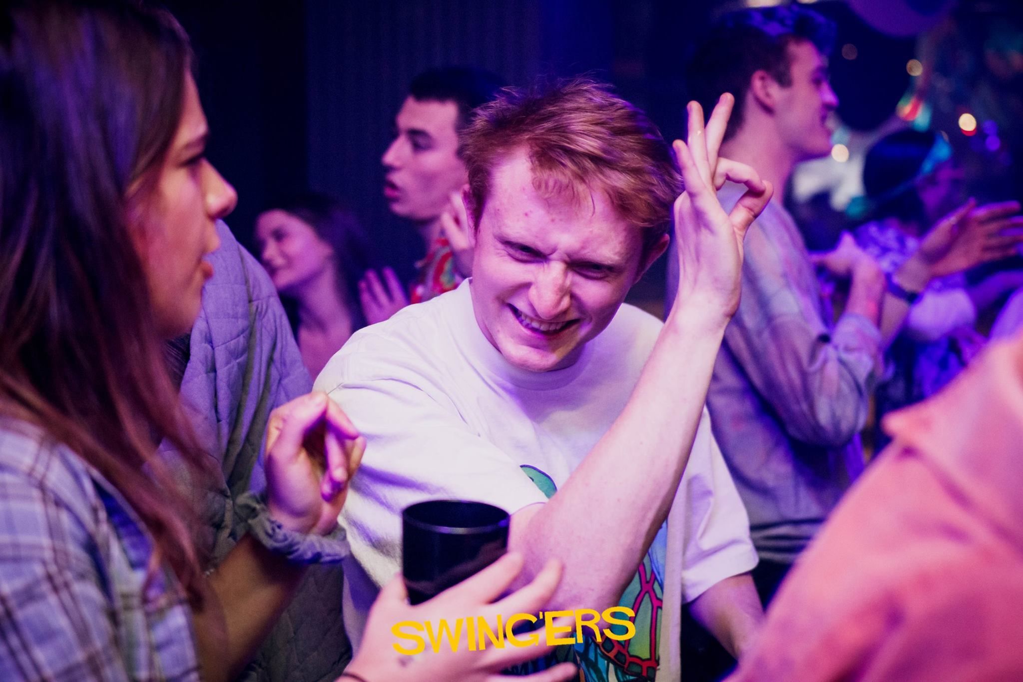 Image may contain: Night Club, Finger, Club, Party, Leisure Activities, Dance Pose, Night Life, Person, Human