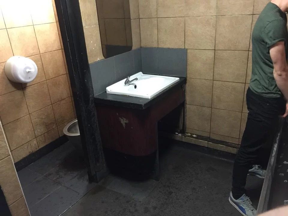 Image may contain: Sink, Drinking Fountain, Fountain, Footwear, Clothing, Apparel, Shoe, Person, Human, Water