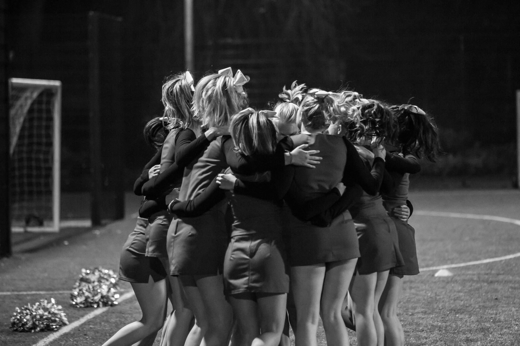 Image may contain: Female, Huddle, Crowd, Person, Human, Clothing, Apparel, Shorts