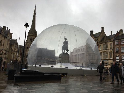 Image may contain: Tent, Metropolis, Planetarium, Town, City, Urban, Downtown, Dome, Building, Architecture, Person, Human
