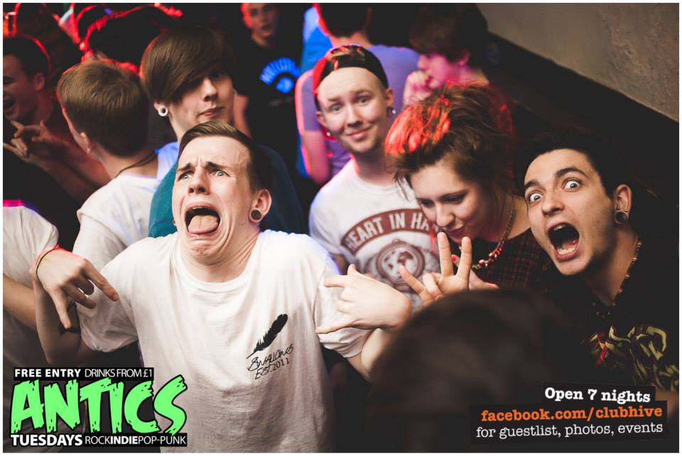 Someone is definitely sticking a finger up his bum. We suspect fringe guy.