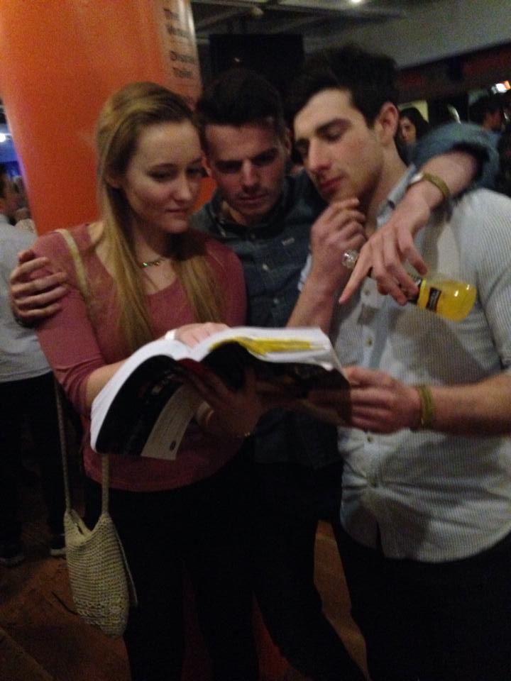 VK in one hand, textbook in the other.