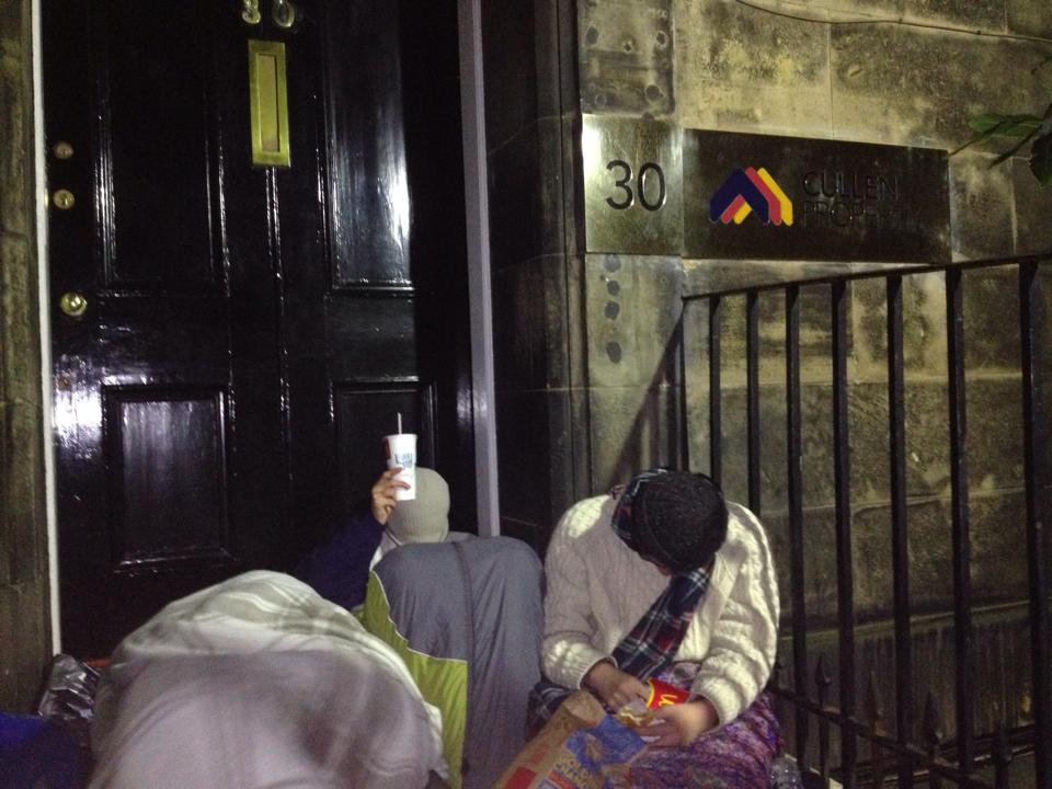 Camped outside at midnight in the freezing cold.