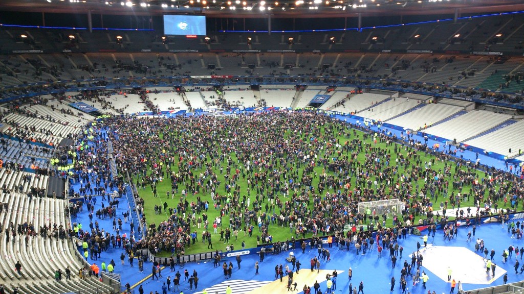 Football fans rush to leave the stadium