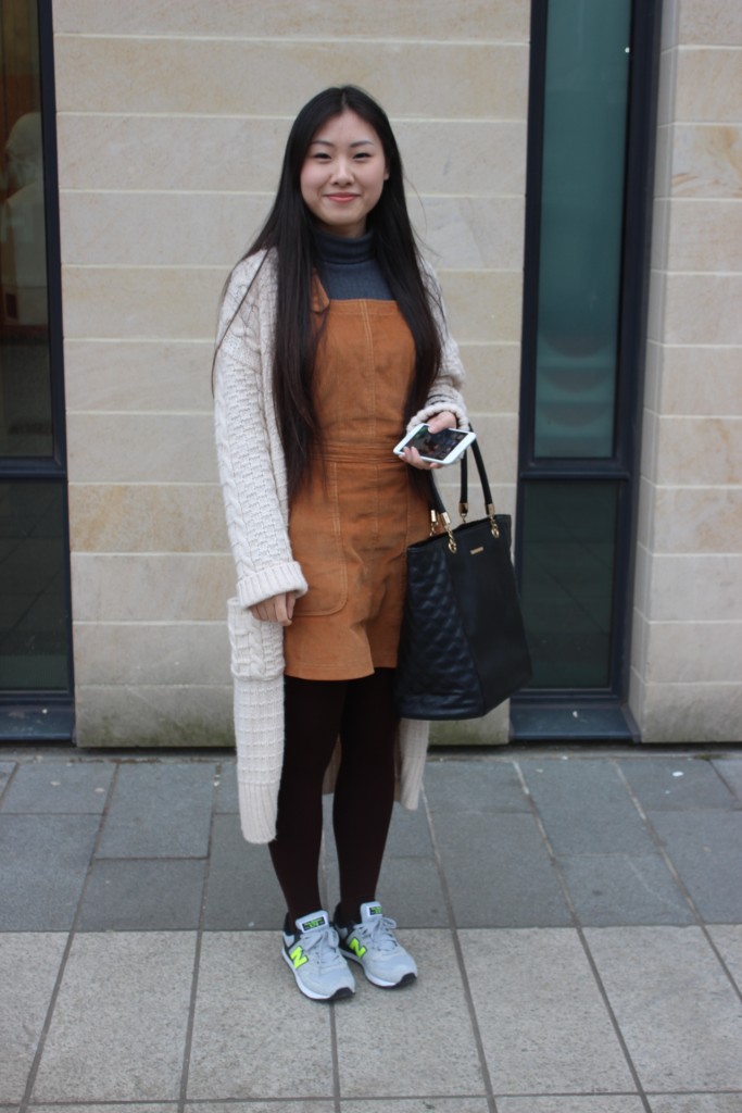 Winter to Spring Transition - Jing layers up these suede dungarees with a blue turtle neck, long cardi and cosy tights. Her New Balance trainers finish off this quirky look. Love the colours! 