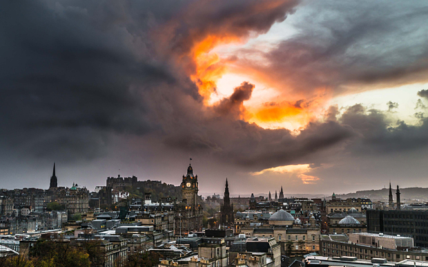 PIC FROM TOM FOSTER/MERCURY PRESS (PICTURED: Dragon/hand of God cloud formation) A doctor has caught on camera the moment what looked like a fire-breathing DRAGON appeared over the skies of Edinburgh. Tom Foster, 25, was taking pictures of the Scottish capital when he says the heavens opened and a giant raincloud appeared against the sunset. The junior doctor realised he had caught what looked like a dragon or even the hand of God' reaching down to grasp Edinburgh Castle in its flaming palm. SEE MERCURY COPY