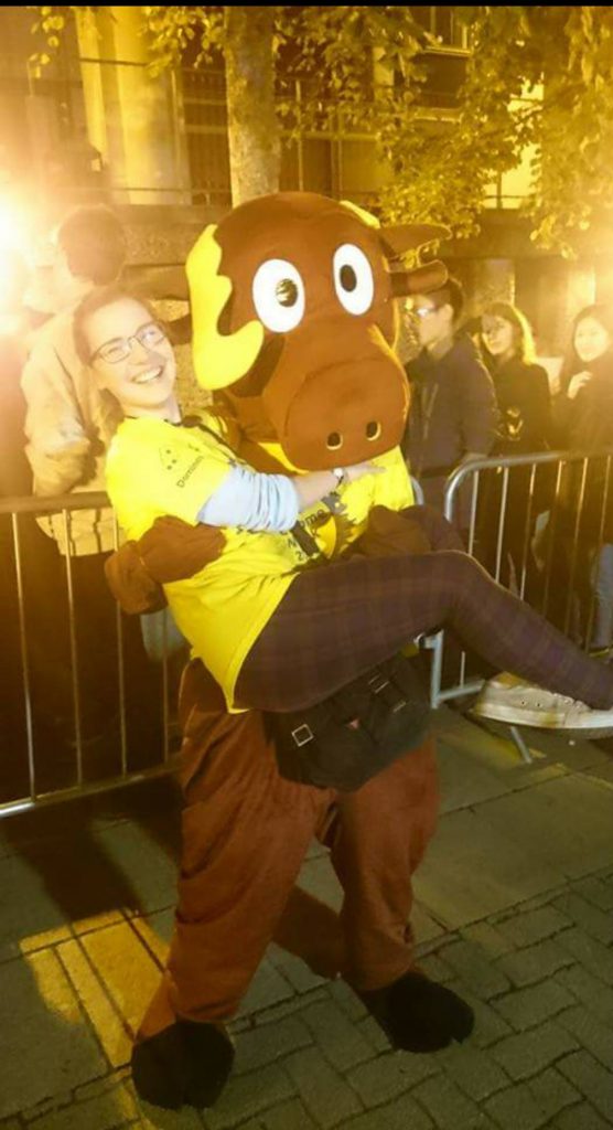 The author dressing up as a moose outside the Prow queue