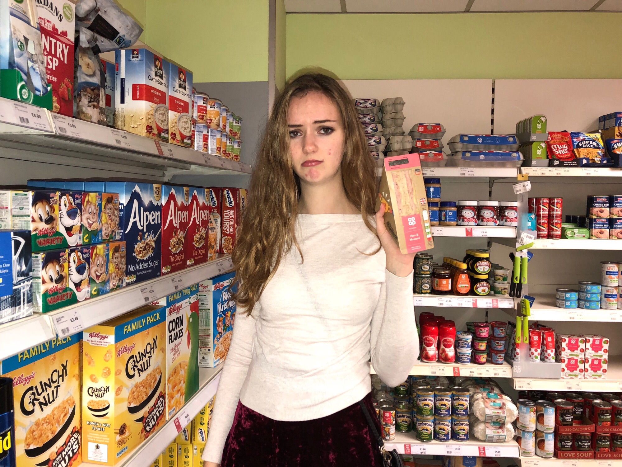 Image may contain: Shelf, Pantry, Shop, Person, People, Human