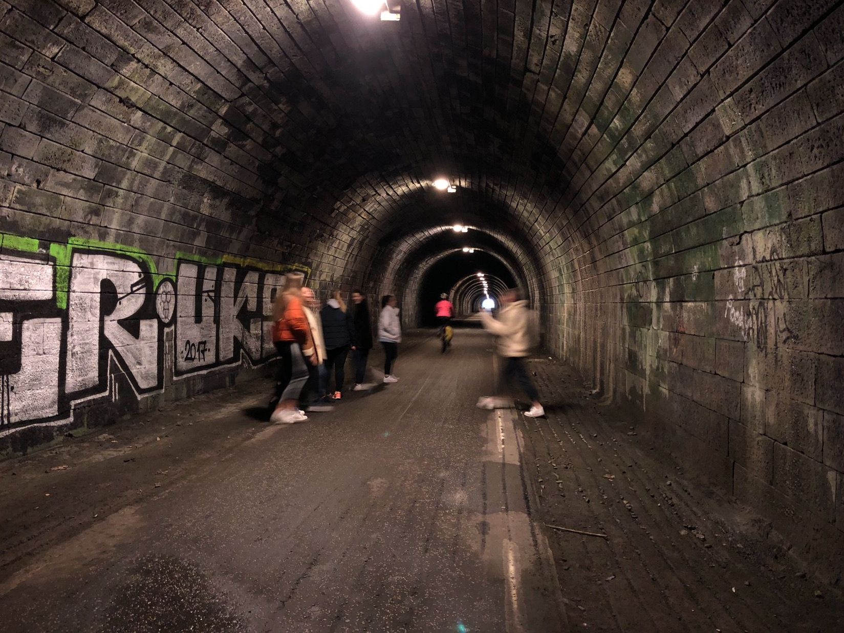 Image may contain: Tunnel, Brick, Dungeon, Graffiti