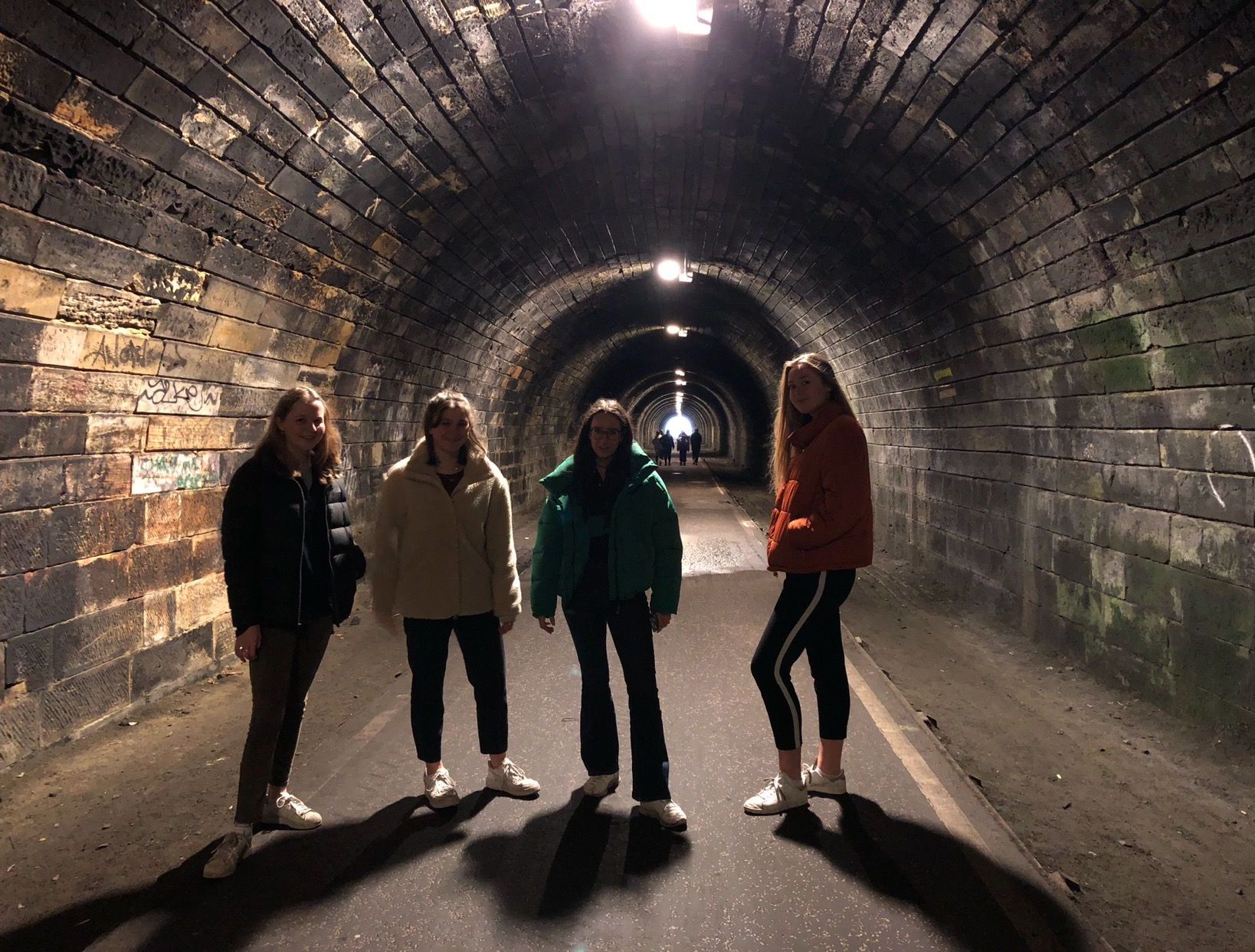 Image may contain: Walking, Leisure Activities, Tunnel, Person, People, Human