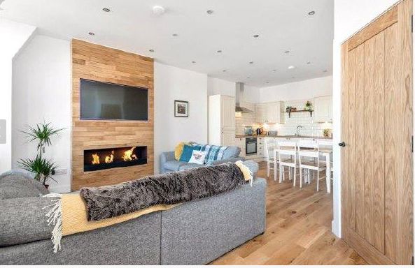 Image may contain: Wardrobe, Furniture, Closet, Room, Living Room, Interior Design, Sliding Door, Folding Door, Door, Loft, Indoors, Housing, Building, Apartment, Hearth, Fireplace, Vase, Pottery, Potted Plant, Plant, Jar, Flora