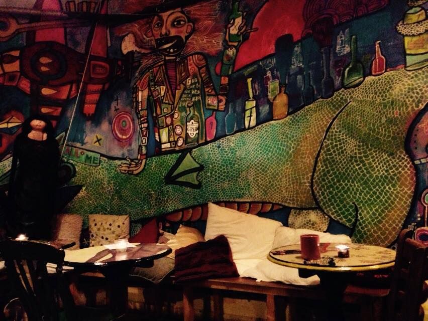 Image may contain: Bowl, Furniture, Chair, Restaurant, Tapestry, Ornament, Art, Person, People, Human