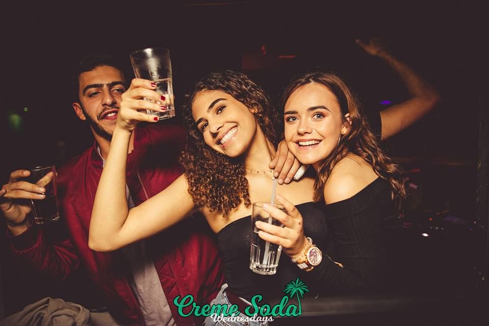 Image may contain: Night Life, Night Club, Club, Drink, Beverage, Alcohol, Person, People, Human