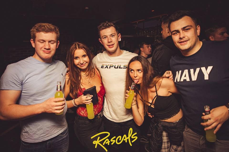 Image may contain: Beer, Alcohol, Bottle, Beverage, Drink, Night Club, Club, Party, Human, Person
