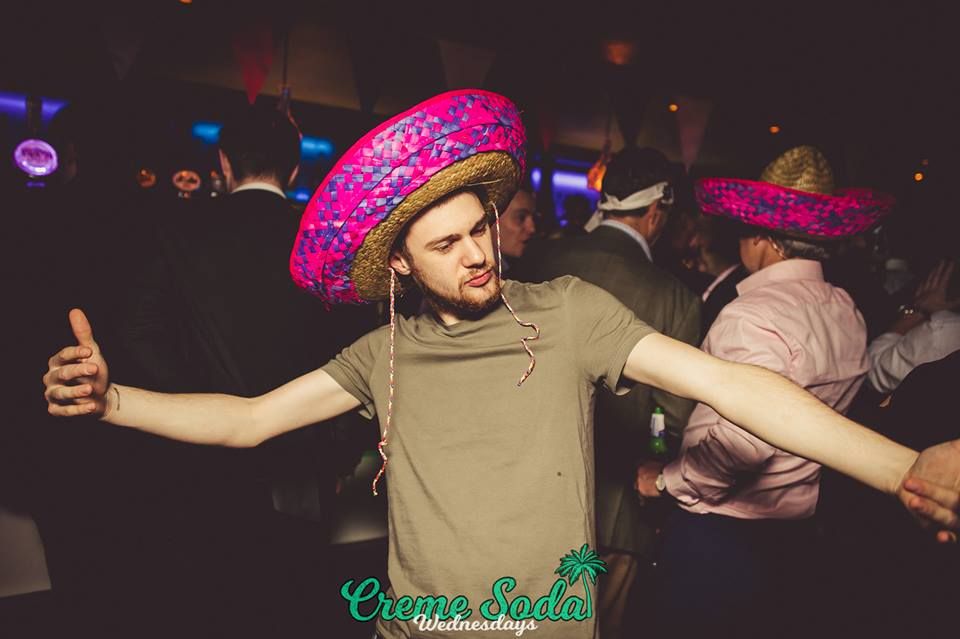Image may contain: Club, Party, Hat, Human, Person, Apparel, Clothing