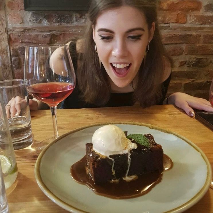 Image may contain: Dining Table, Chocolate, Table, Furniture, Vegetation, Plant, Cream, Creme, Ice Cream, Wine, Dessert, Alcohol, Drink, Beverage, Dish, Glass, Food, Meal, Person, Human