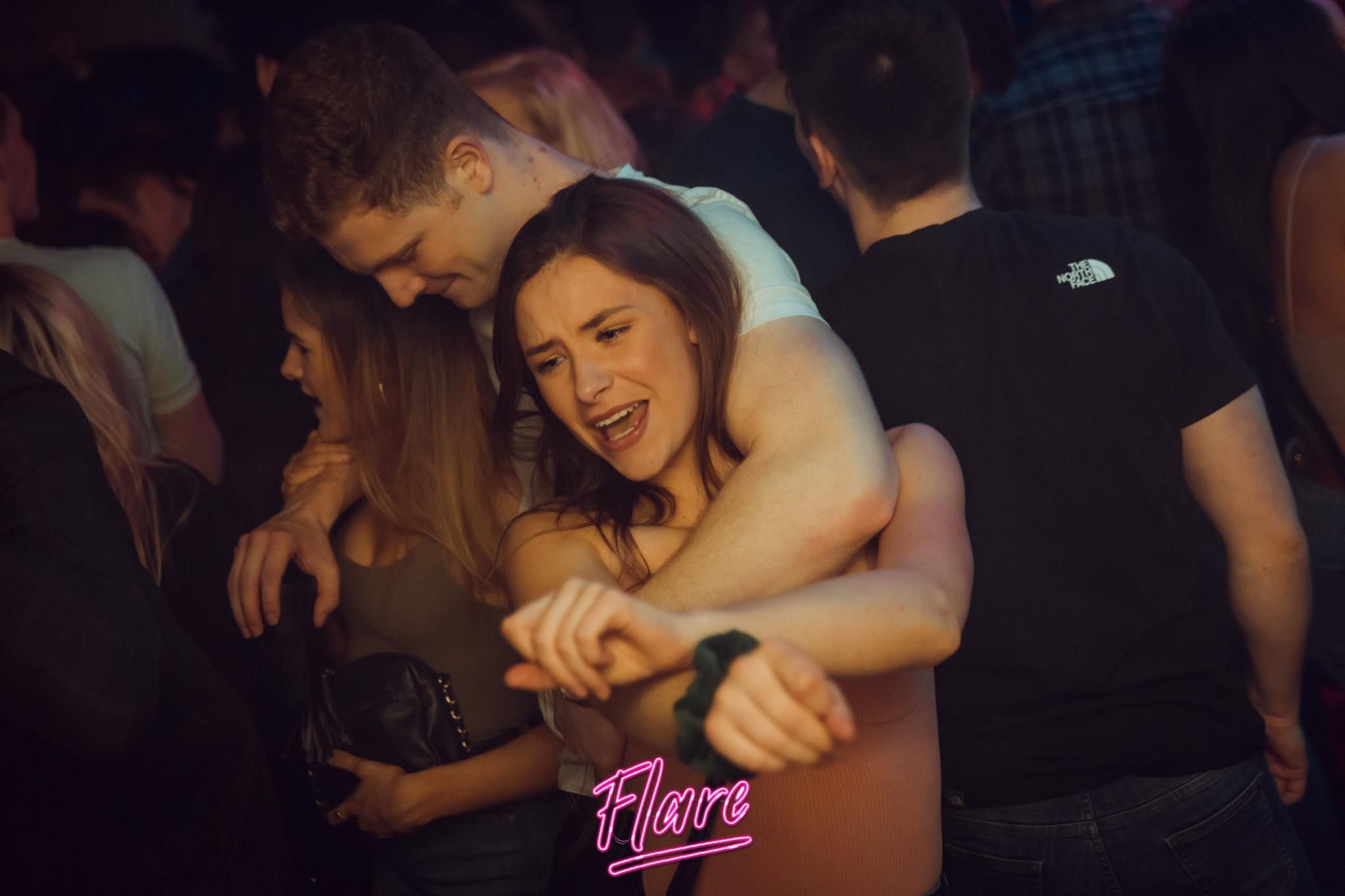 Image may contain: Finger, Party, Skin, Dating, Clothing, Apparel, Night Club, Night Life, Club, Human, Person