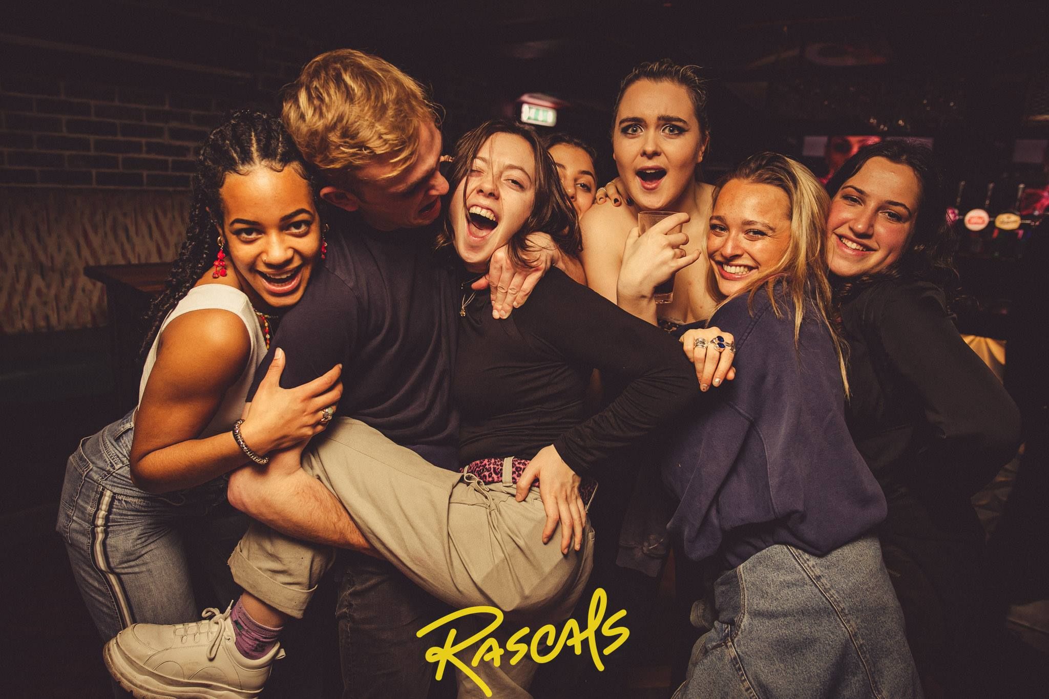 Image may contain: People, Night Life, Face, Night Club, Club, Party, Human, Person