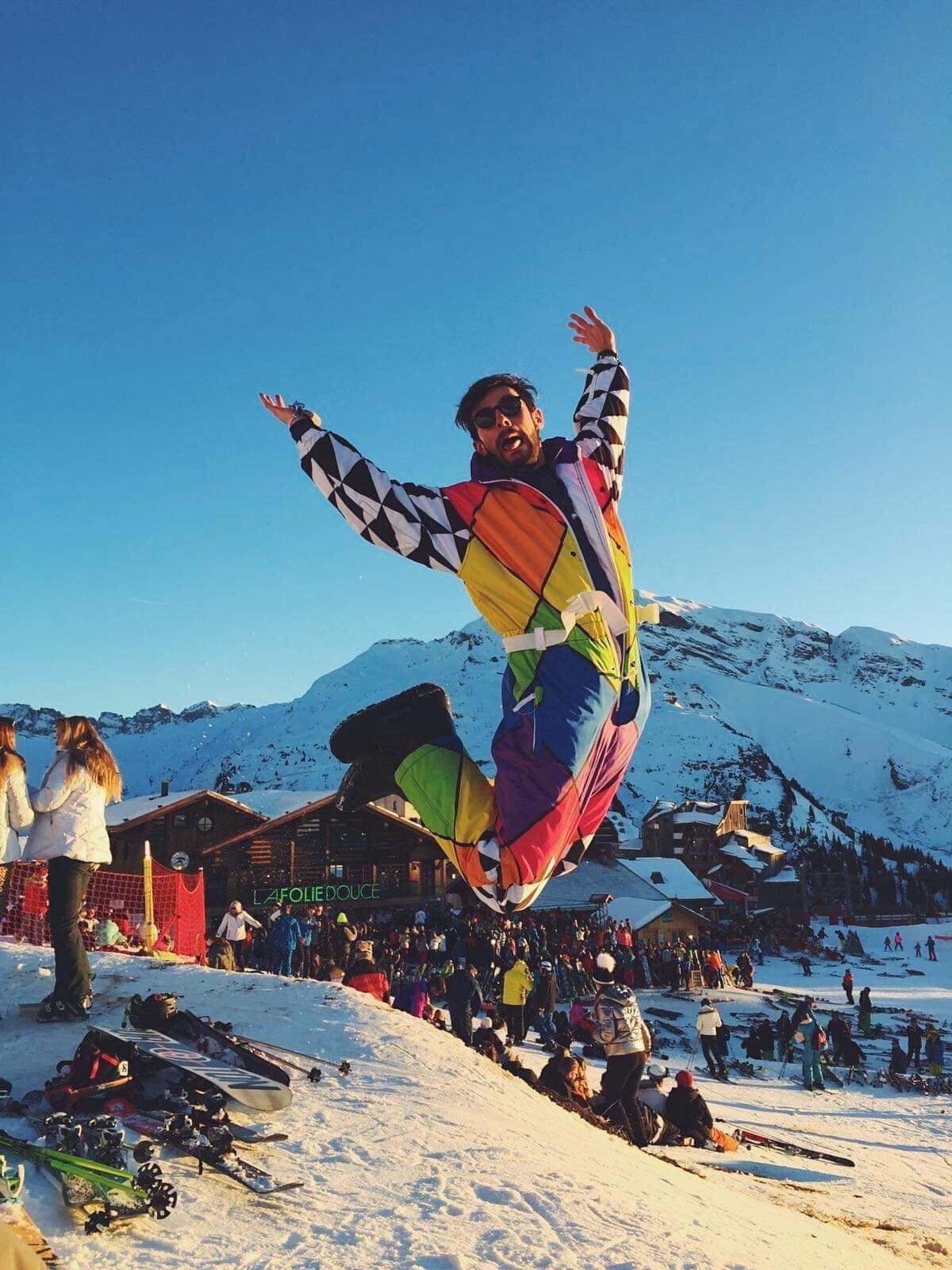 Image may contain: Clothing, Apparel, Peak, Mountain Range, Mountain, Slope, Sports, Snow, Sport, Snowboarding, Outdoors, Nature, Adventure, Leisure Activities, Human, Person