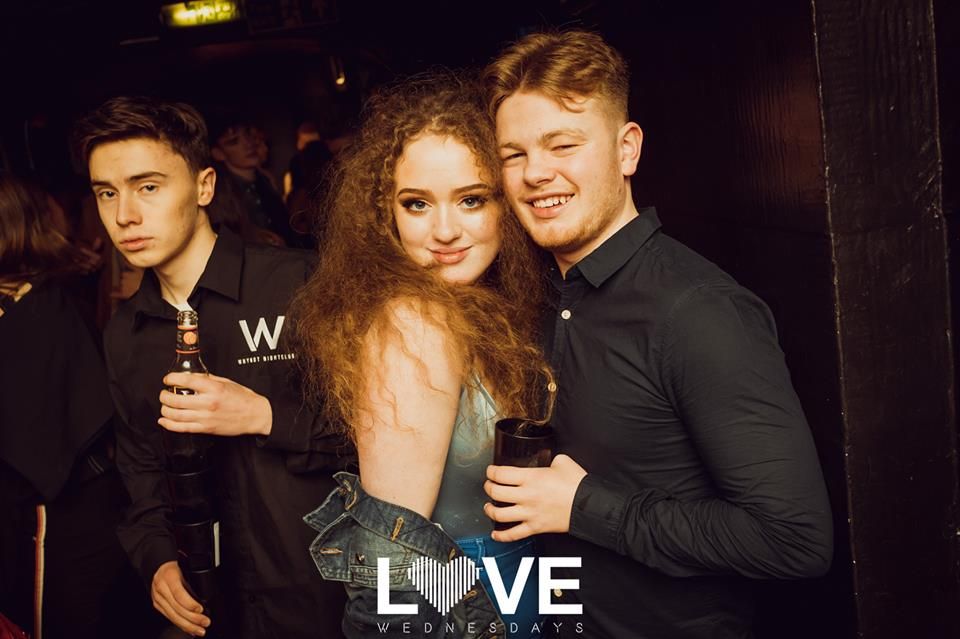 Image may contain: Night Club, Bar Counter, Pub, Face, Beverage, Drink, Dating, Night Life, Club, Party, Human, Person