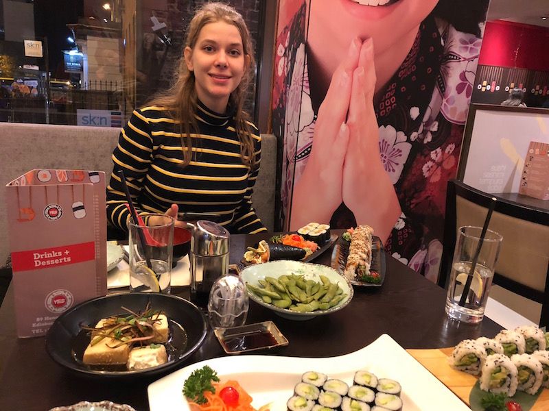 Image may contain: People, Portrait, Photo, Photography, Furniture, Table, Glass, Cafeteria, Animal, Sea Life, Lobster, Seafood, Face, Dish, Restaurant, Food, Meal, Person, Human