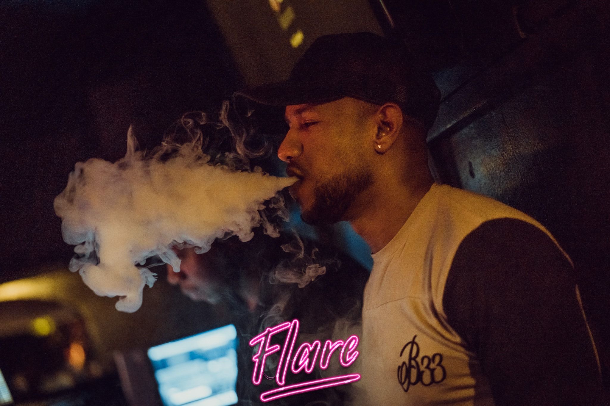 Image may contain: Bar Counter, Pub, Apparel, Clothing, Poster, Advertisement, Smoke, Human, Person