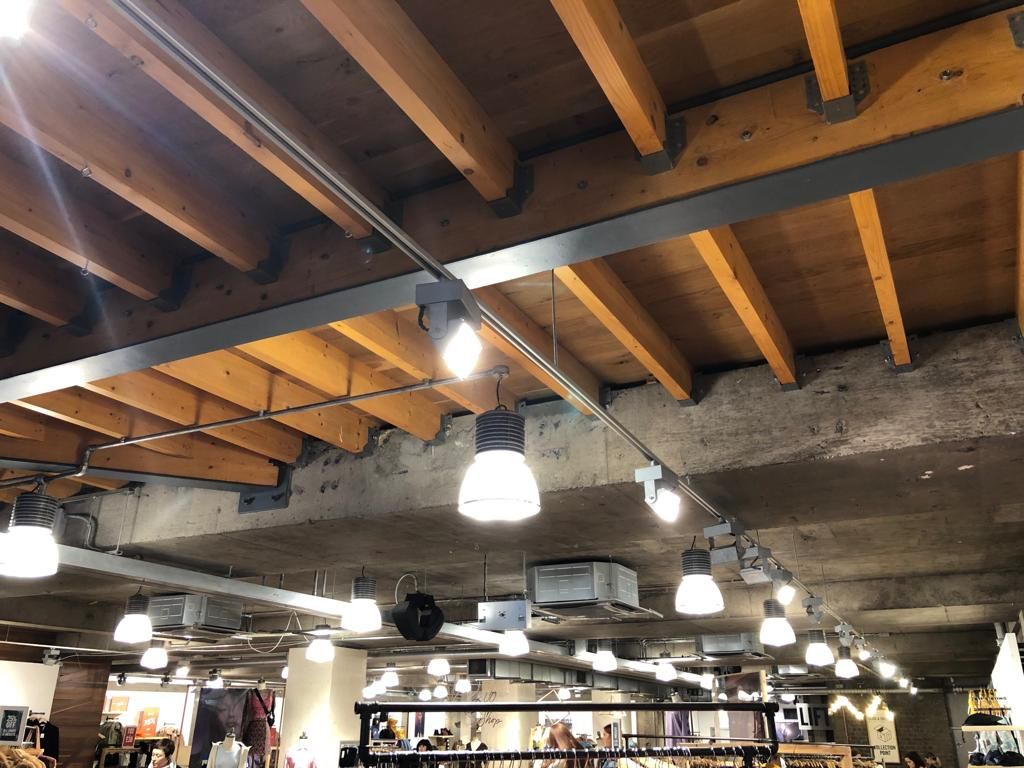 Image may contain: Bookstore, Book, Building, Shop, Aircraft, Airplane, Transportation, Vehicle, Interior Design, Indoors, Person, Human, Wood, Lighting