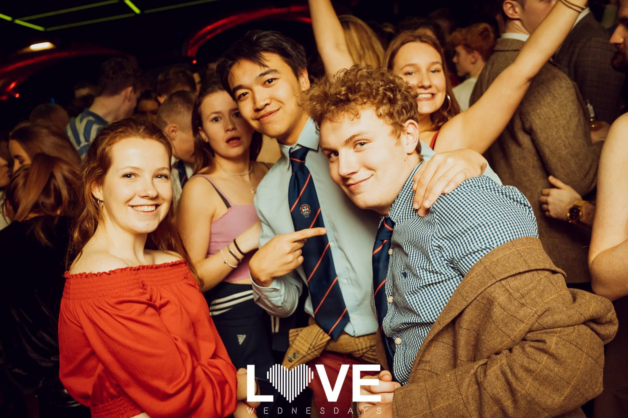 Image may contain: Crowd, Audience, Night Club, Club, Accessory, Accessories, Tie, Party, Night Life, Person, Human