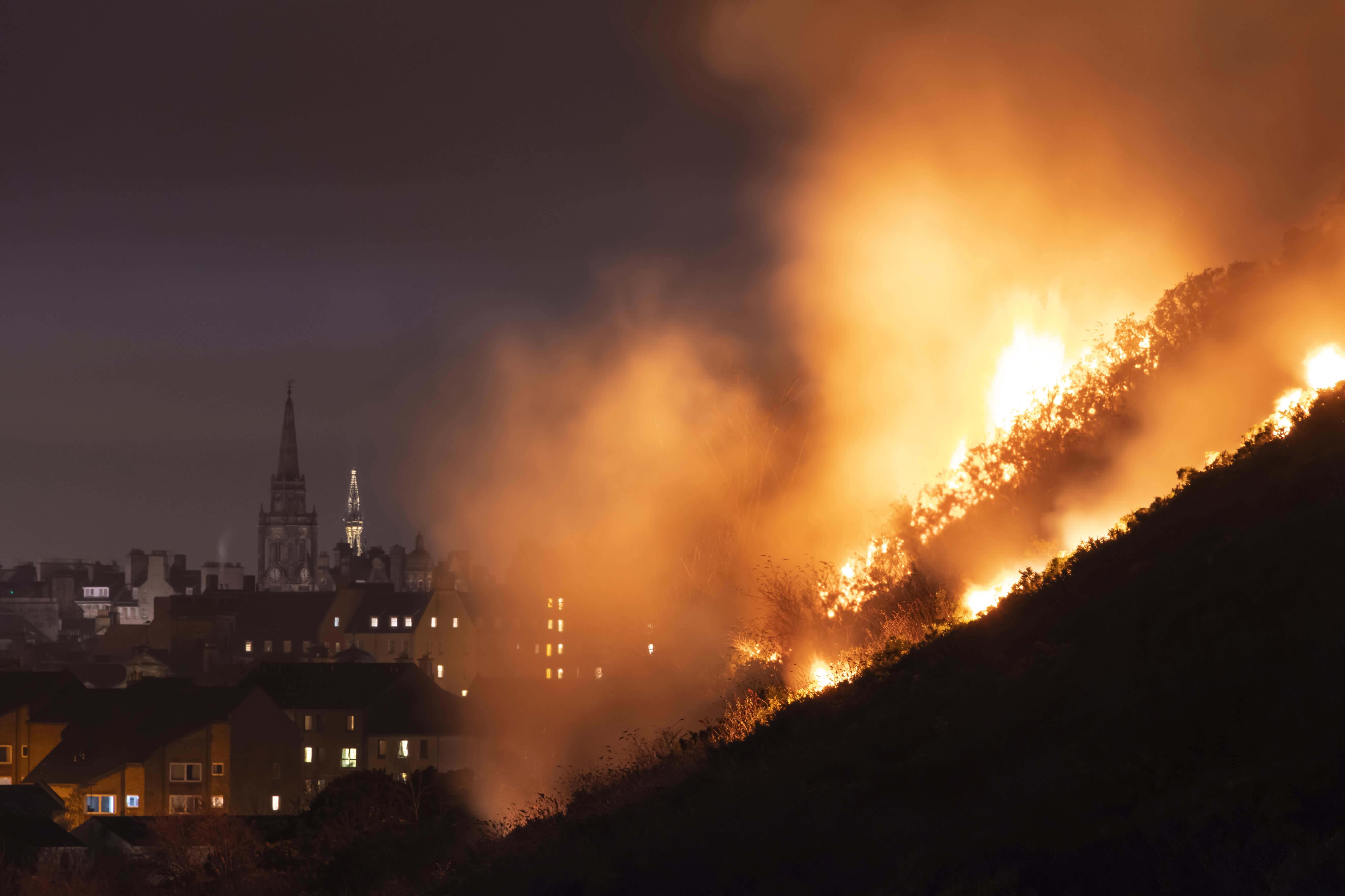 Image may contain: Forest Fire, Spire, Tower, Architecture, Steeple, Flame, Bonfire, Building, Fire