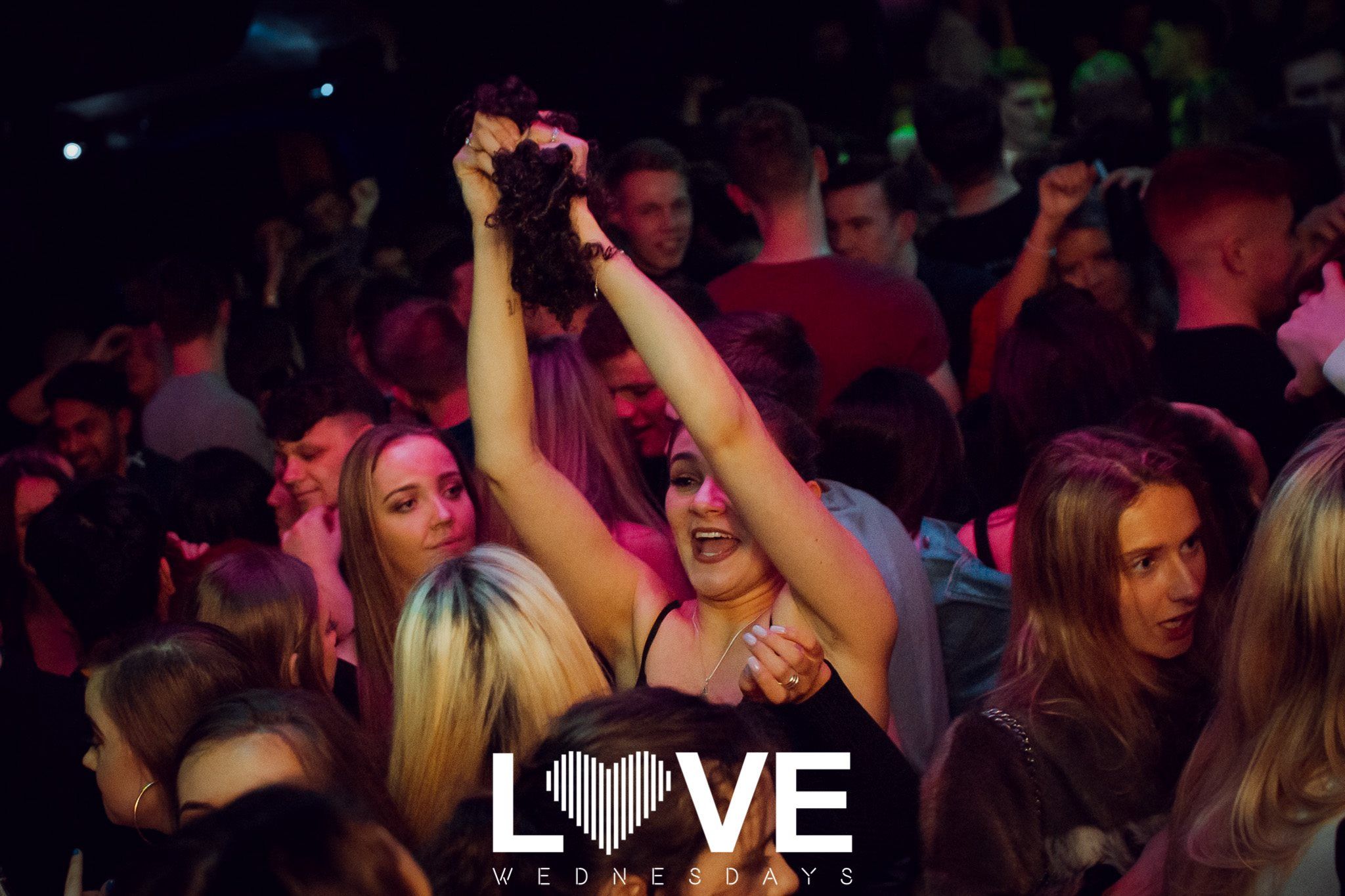 Image may contain: Indoors, Interior Design, Crowd, Audience, Night Club, Club, Party, Night Life, Human, Person