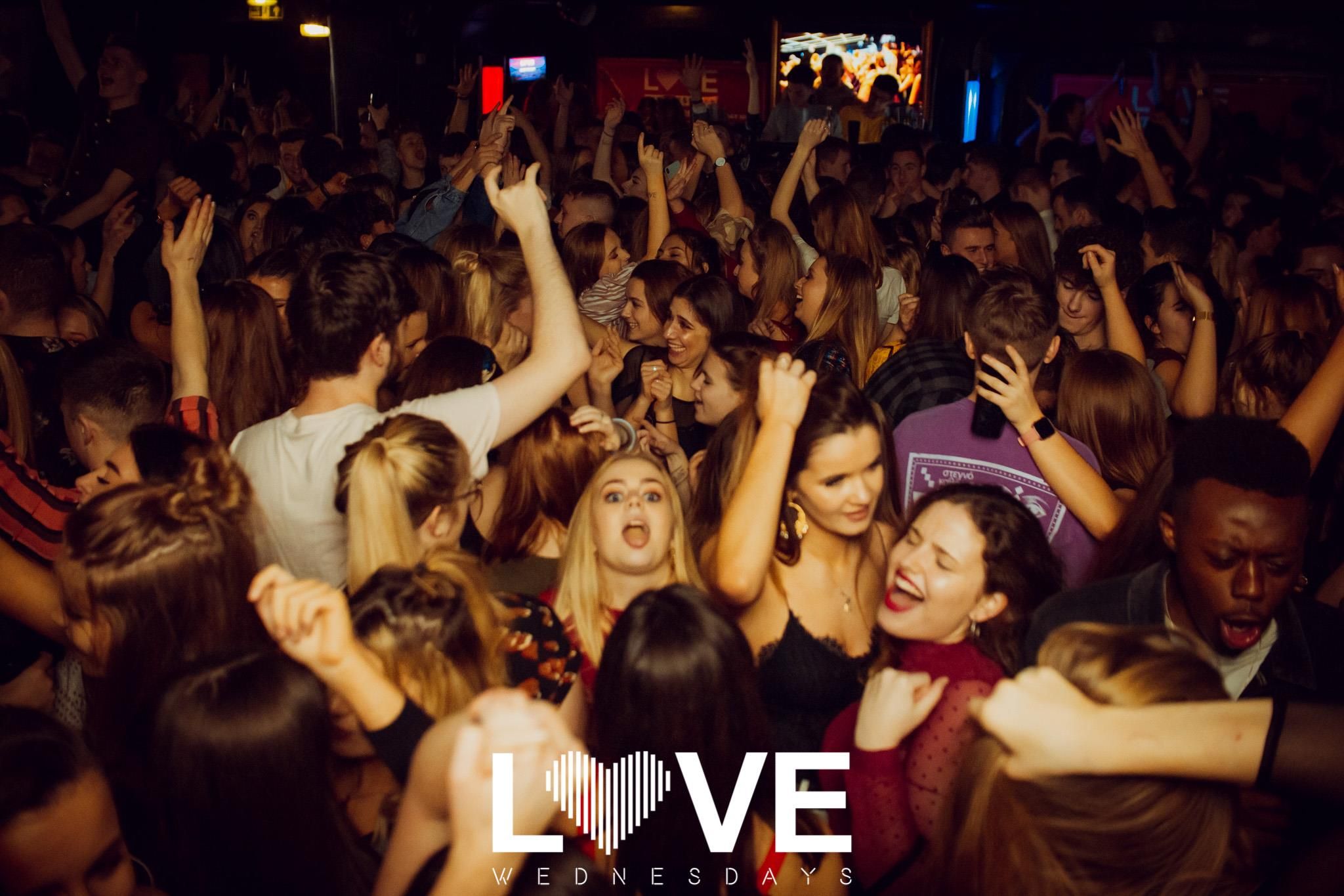 Image may contain: Interior Design, Indoors, Audience, Crowd, Night Club, Club, Person, Human, Night Life, Party
