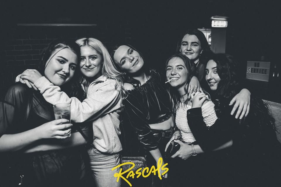 Image may contain: Jacket, Coat, Club, Laughing, Female, People, Apparel, Clothing, Party, Smile, Face, Person, Human