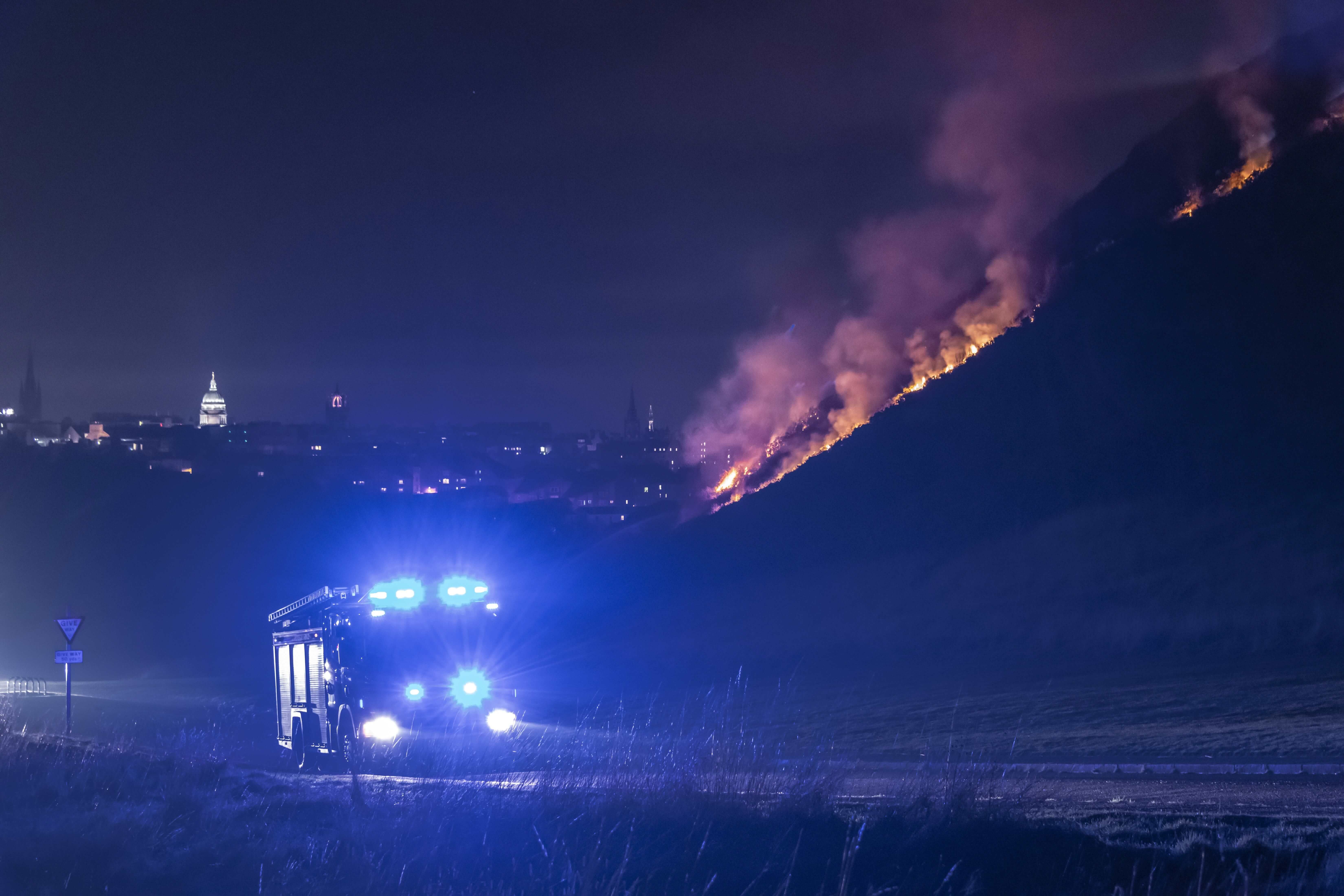 Image may contain: Road, Fire, Outdoors, Nature, Mountain, Flare, Light