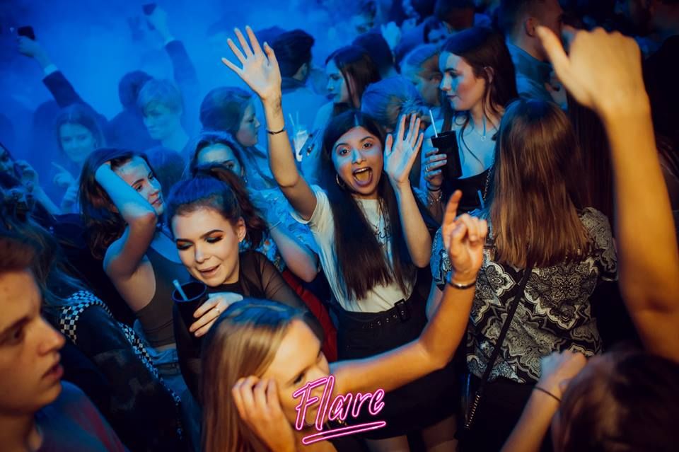 Image may contain: Accessory, Sunglasses, Accessories, Disco, Night Life, Night Club, Club, Person, Human, Party