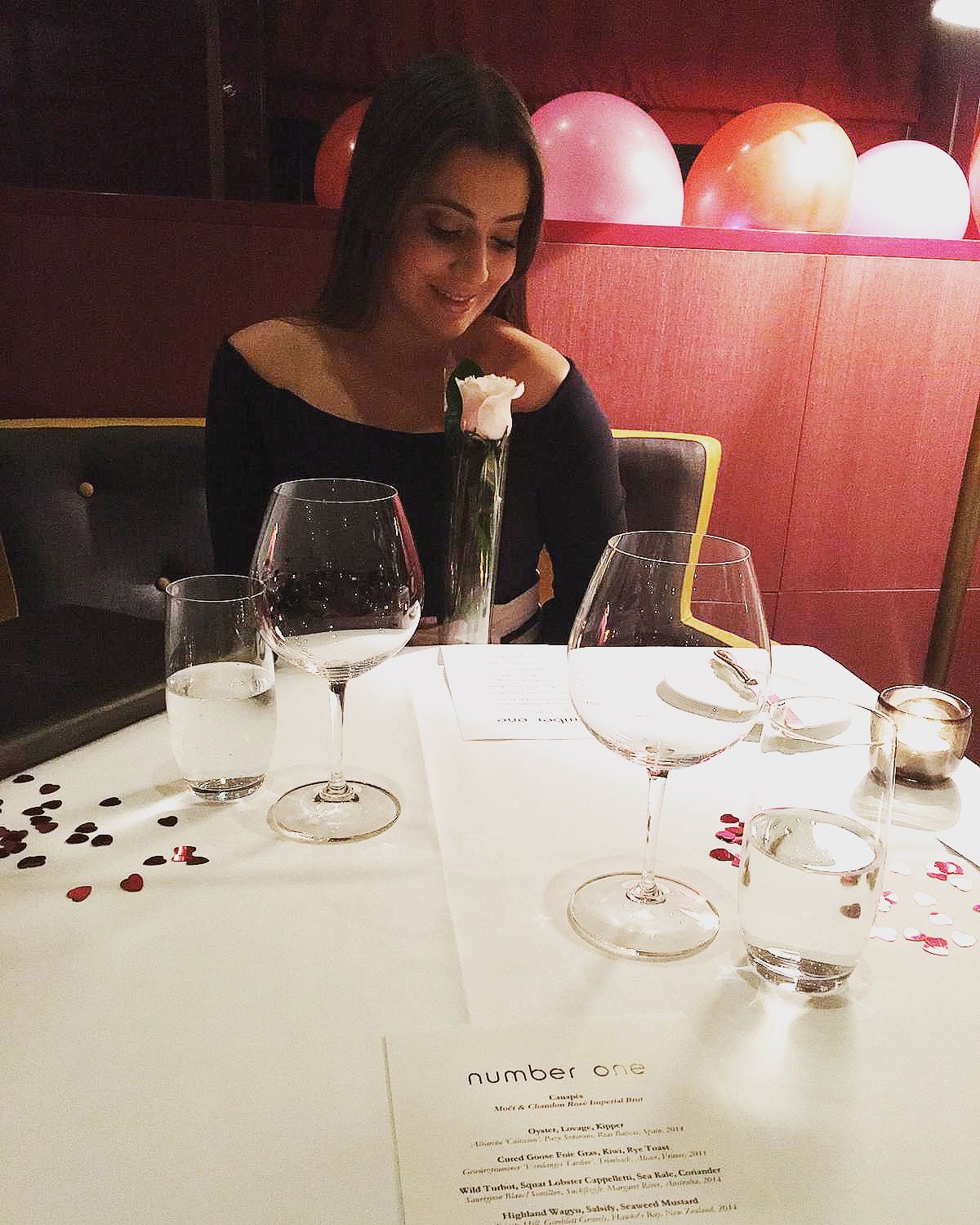 Image may contain: Alcohol, Beverage, Wine Glass, Drink, Wine, Table, Furniture, Dating, Home Decor, Goblet, Glass, Person, Human