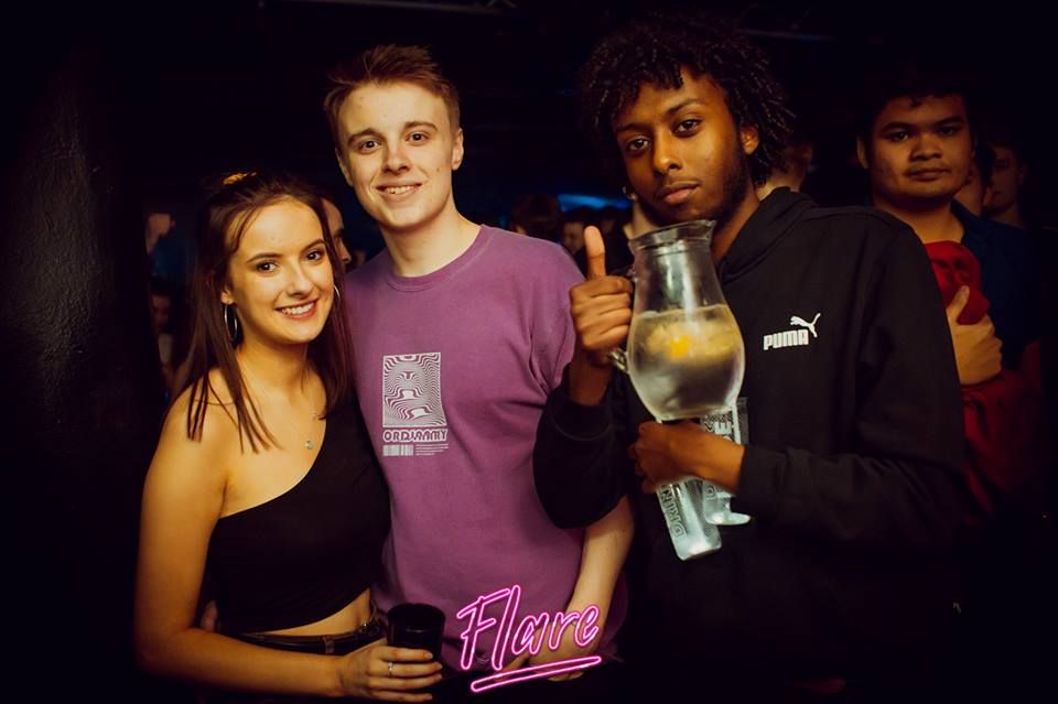 Image may contain: Bar Counter, Pub, Glass, Party, Drink, Beverage, Beer, Alcohol, Night Life, Night Club, Club, Person, Human
