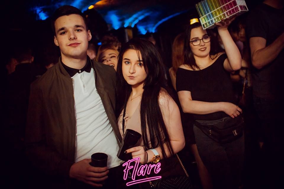 Image may contain: Beverage, Drink, Disco, Phone, Mobile Phone, Electronics, Cell Phone, Night Club, Night Life, Club, Party, Person, Human