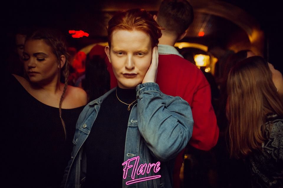 Image may contain: Coat, Jacket, Apparel, Clothing, Bar Counter, Pub, Night Club, Night Life, Club, Person, Human