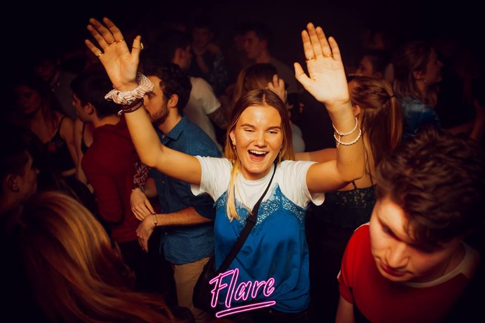 Image may contain: Disco, Crowd, Audience, Face, Night Club, Club, Night Life, Party, Human, Person