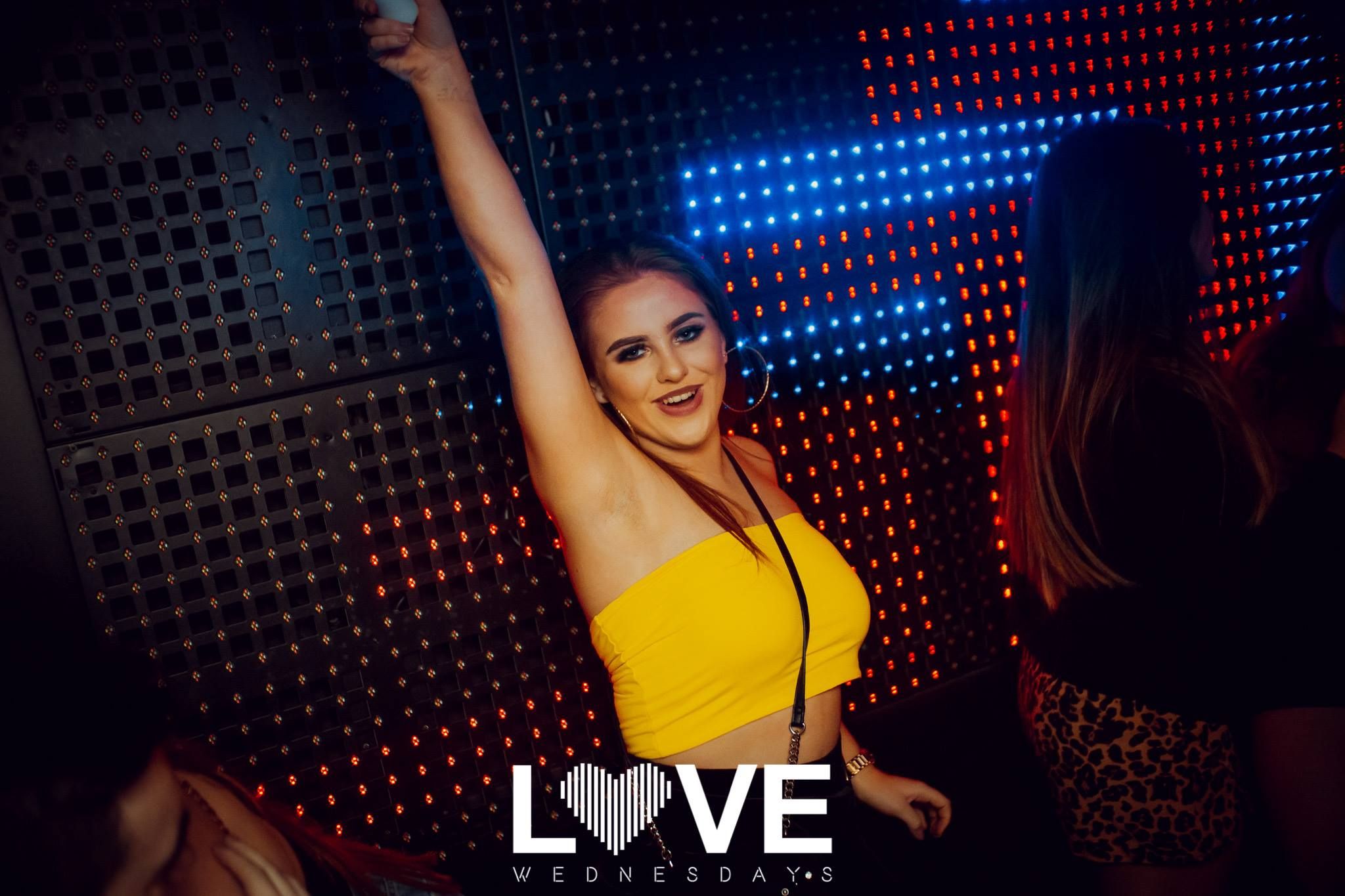 Image may contain: Lighting, Night Life, Night Club, Club, Person, Human