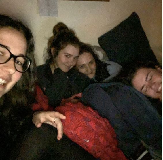 Image may contain: Man, Photo, Portrait, Photography, Interior Design, Bed, Indoors, Female, Clothing, Apparel, Smile, Couch, Furniture, Accessories, Accessory, Glasses, Face, Person, Human, Cushion, Pillow