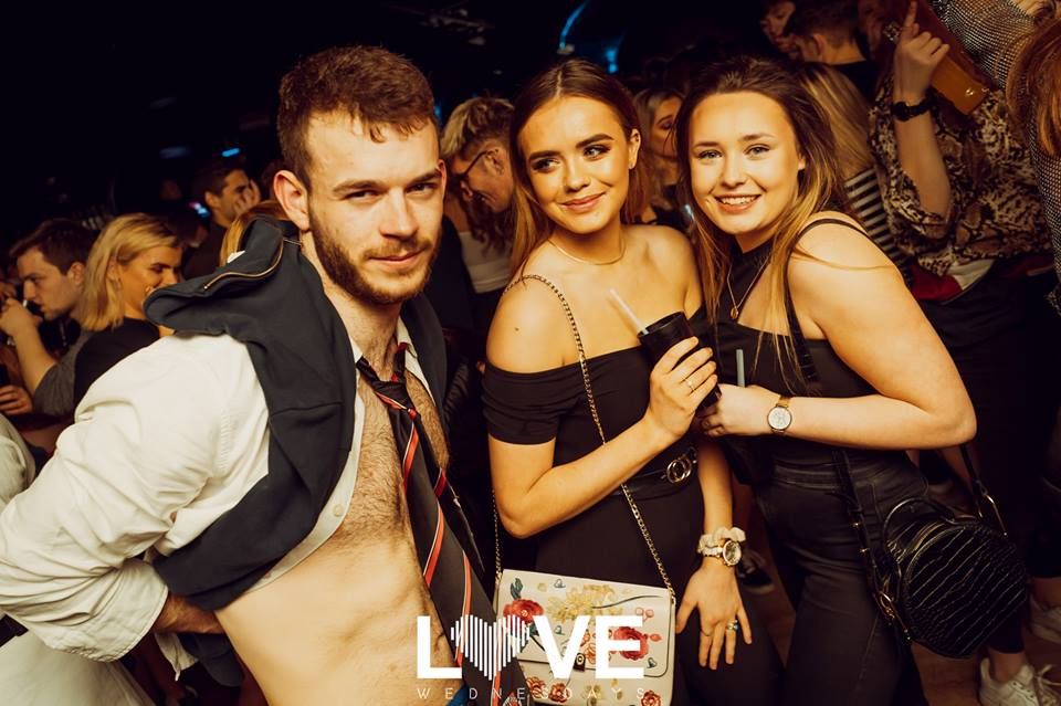 Image may contain: Night Life, Building, Clock Tower, Architecture, Tower, Night Club, Club, Party, Person, Human
