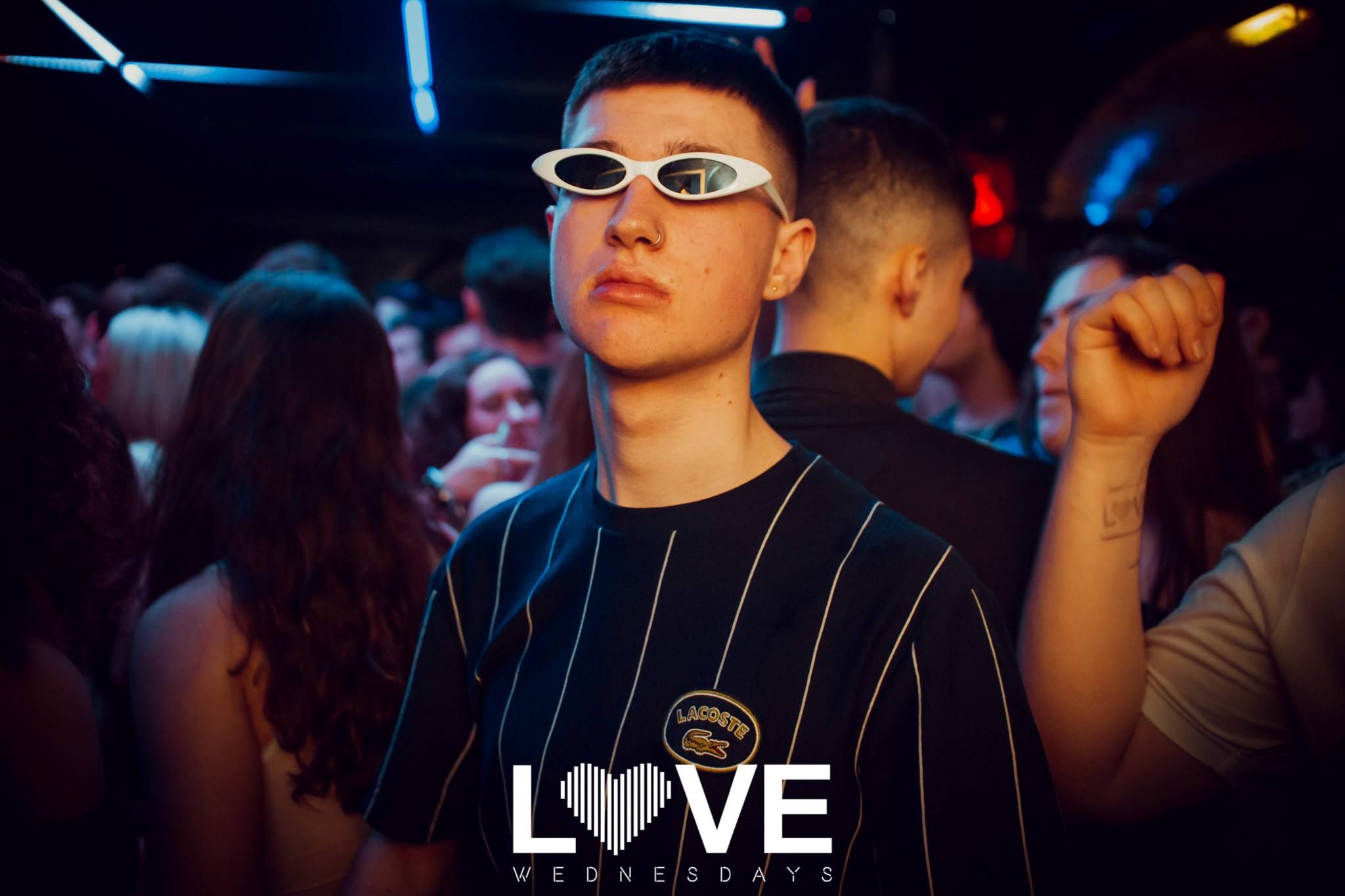 Image may contain: Party, Night Life, Accessory, Sunglasses, Accessories, Club, Night Club, Human, Person