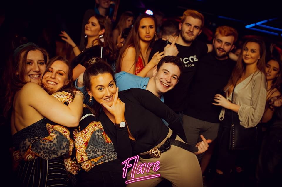 Image may contain: People, Face, Night Club, Interior Design, Indoors, Club, Crowd, Audience, Party, Night Life, Human, Person