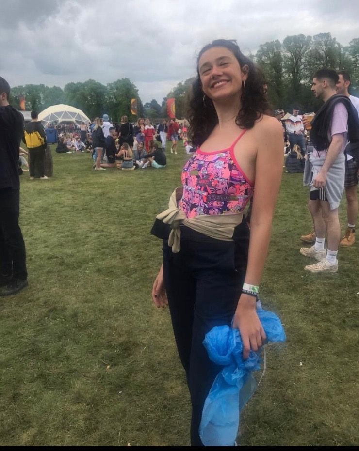 Image may contain: Face, Tent, Girl, Crowd, Shoe, Footwear, Outdoors, Vegetation, Shorts, Woman, Tree, Pants, Grass, Plant, Dress, Female, Clothing, Apparel, Person, Human
